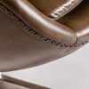 Sillón giratorio diseño clásico vintage tapizado piel color marrón con costuras y tachuelas pata de hierro5