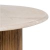 Mesa de centro redonda diseño vintage sobre mármol blanco y pata central cilindro estriada