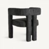 Exclusiva silla o sillón, de diseño moderno, con originales formas curvas y elegante tapizado en algodón bouclé en color negro