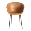 615518 Silla de diseño industrial formas redondeadas simil piel camel y patas metal negro